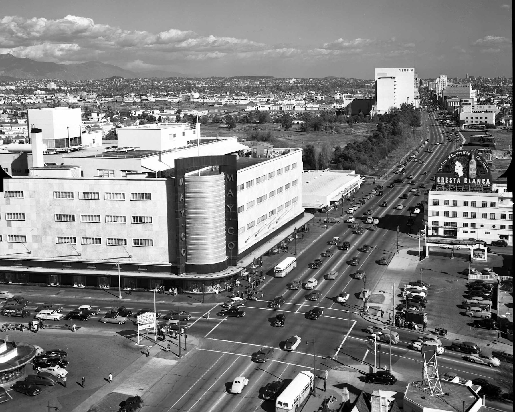 Aerial view, May Company department store, 6067 Wilshire Blvd., Los Angeles, California, looking east down the 'miracle mile,' 1949. Bison Archives photographs collected by Marc Wanamaker, Margaret Herrick Library, Academy of Motion Picture Arts and Sciences.

