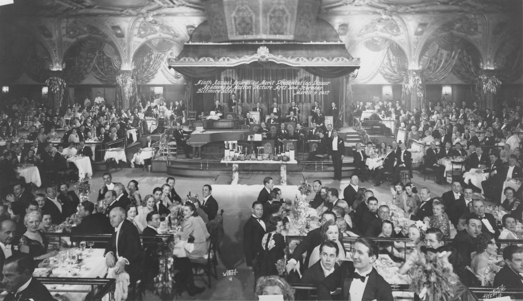 The ninth Annual Awards of Merit Presentation Dinner was held at the Biltmore Hotel on March 4, 1937, featuring guests Cecil B. DeMille (foreground, left), Henry Fonda (foreground, center right), and Walt Disney (far right)

Courtesy of Academy Awards show photographs, Margaret Herrick Library, Academy of Motion Picture Arts and Sciences, photo: Weaver L.A. 