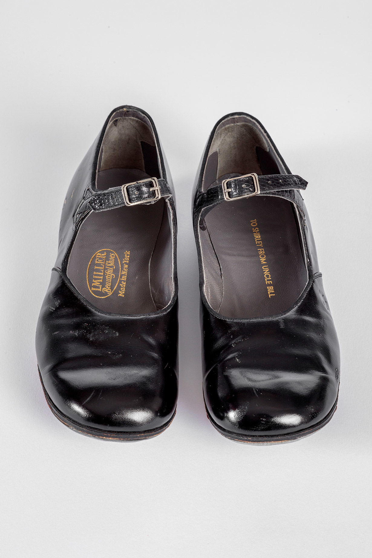 Shirley Temple's tap shoes and practice steps used during filming of <i>The Little Colonel</i> (1935).  Academy Museum of Motion Pictures, Gift of Shirley Temple Black and Family. Photo by Joshua White, JWPictures/©Academy Museum Foundation