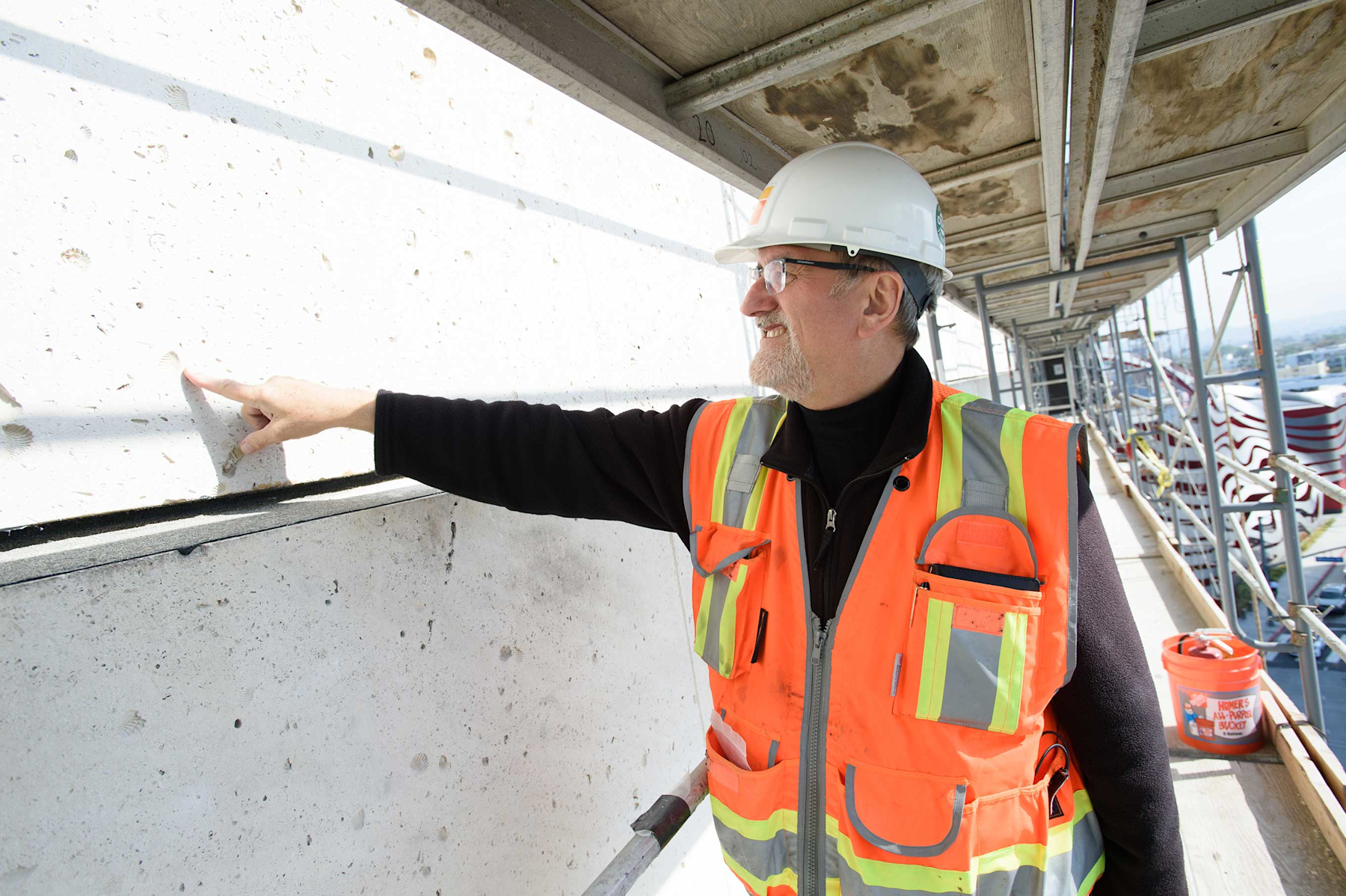 Restoration expert John Fidler with deteriorated building material from the former May Co. building at Wilshire Blvd. and Fairfax Ave being restored as the Academy Museum of Motion Pictures. ©Academy Museum Foundation