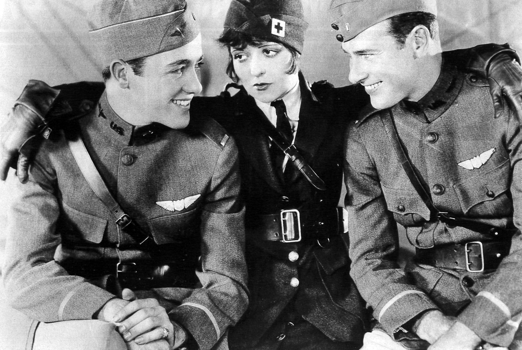 Charles Rogers, Clara Bow, and Richard Arlen in a production still from the Paramount silent film Wings (1927), Pictorial Press Ltd./Alamy Stock Photo.
