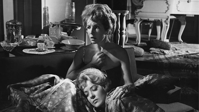 Inspired by the angel of death, Luis Buñuel’s original script is a pitch-black satire about a wealthy group of friends who find themselves unable to leave a room after a dinner party.