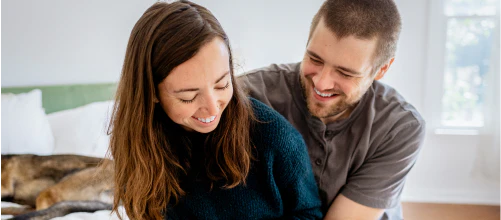 Man and a woman laughing together