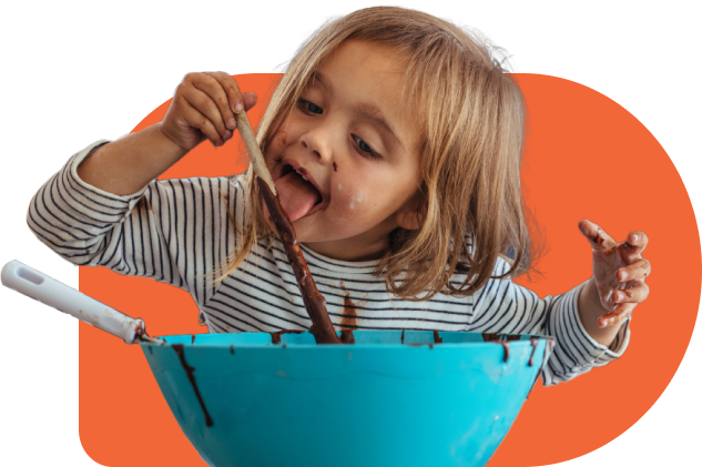 Girl eating chocolate from bowl