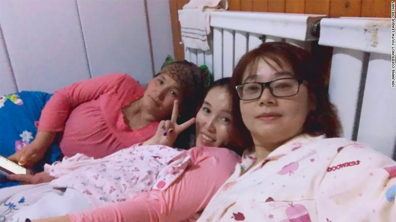 A photo posted online in 2017 shows two women in bed with a female host.jpeg