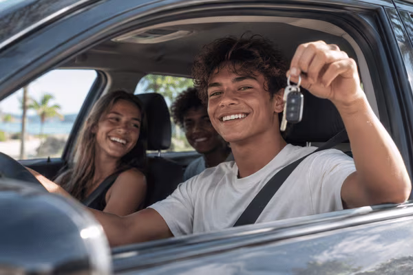 Young driver with his rental car keys