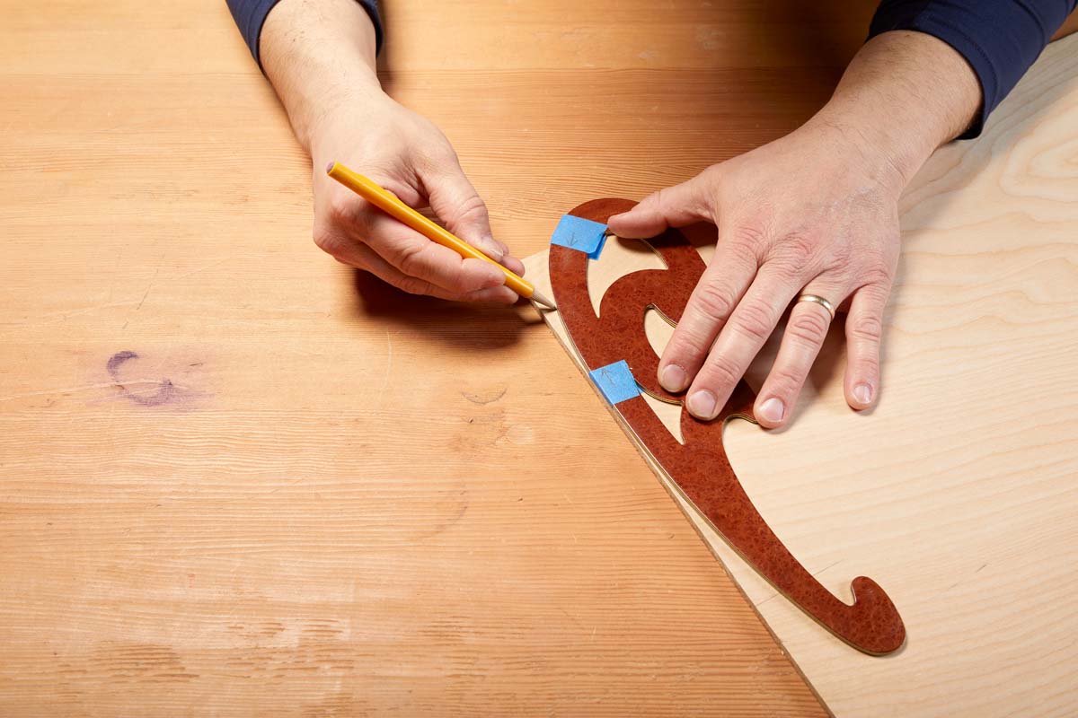 tracing French curves on plywood with mirrored template side