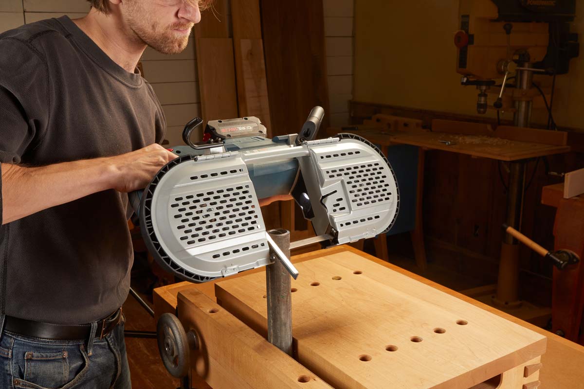 BOSCH DEEP-CUT BAND SAW cutting through steel at 45° angle