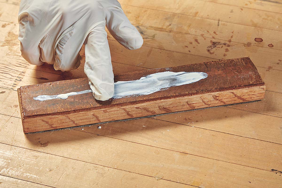 Step 1: spreading white honing compound paste onto strop