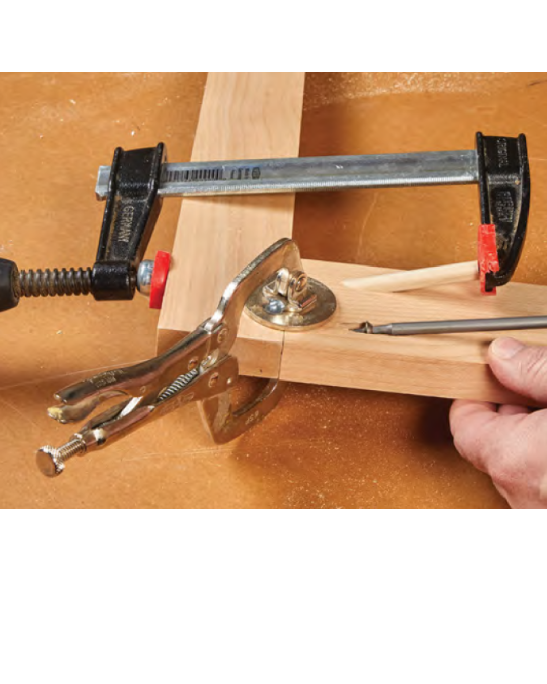 image showing clamping a dowel through the pilot hole to drill during assembly