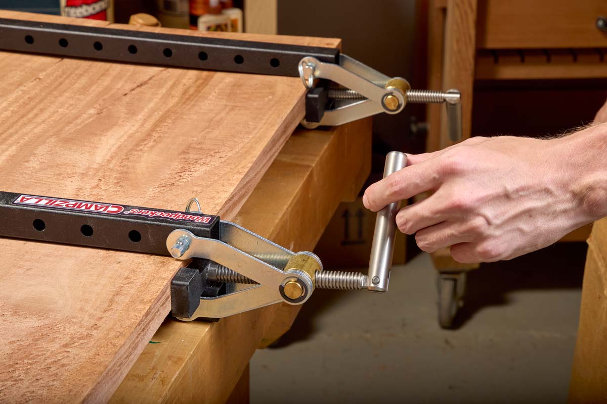 adding woodpeckers panel clamps to work table uses the clamp's screw tighten them on the panel