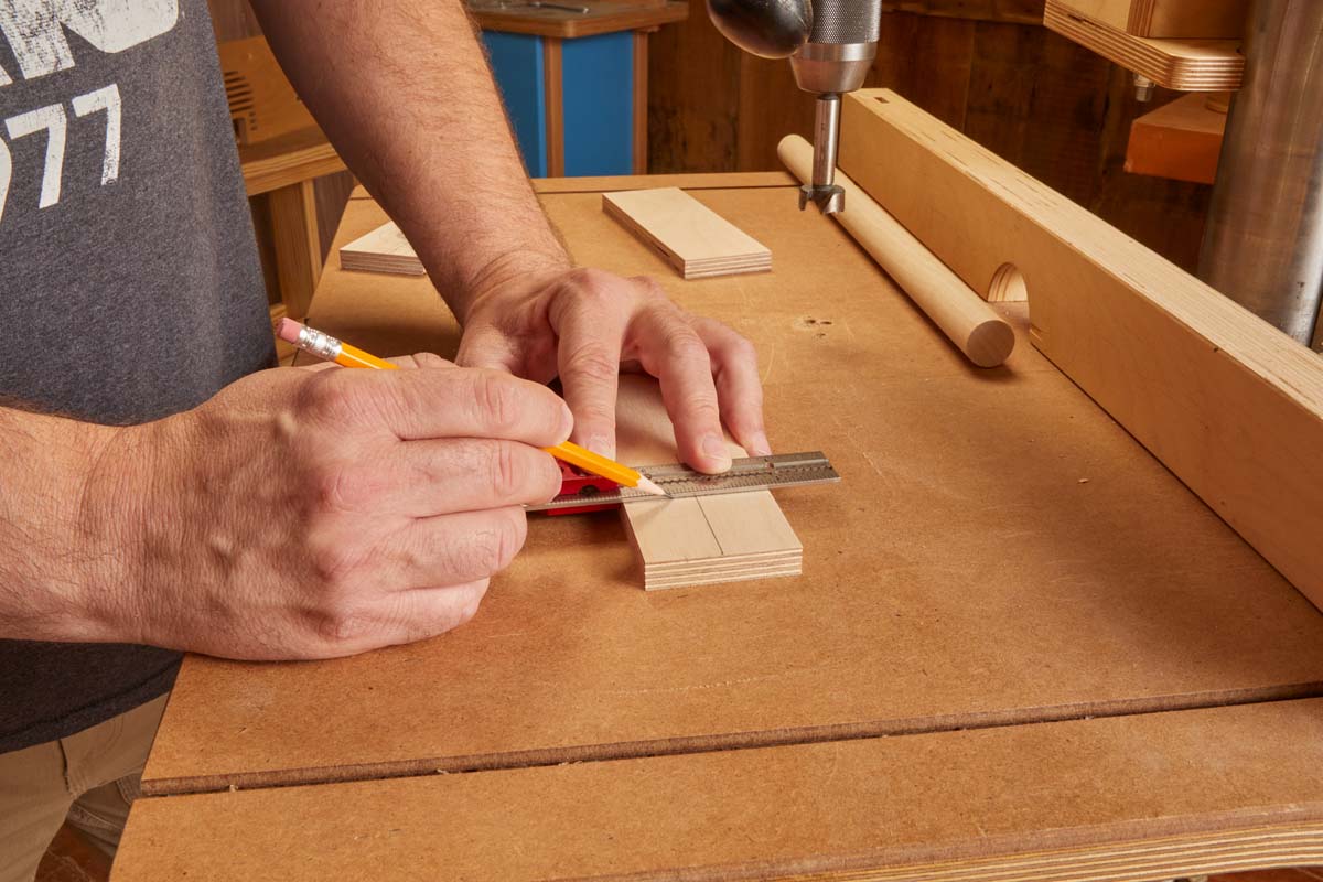 marking centerline on wood piece for dowel hole