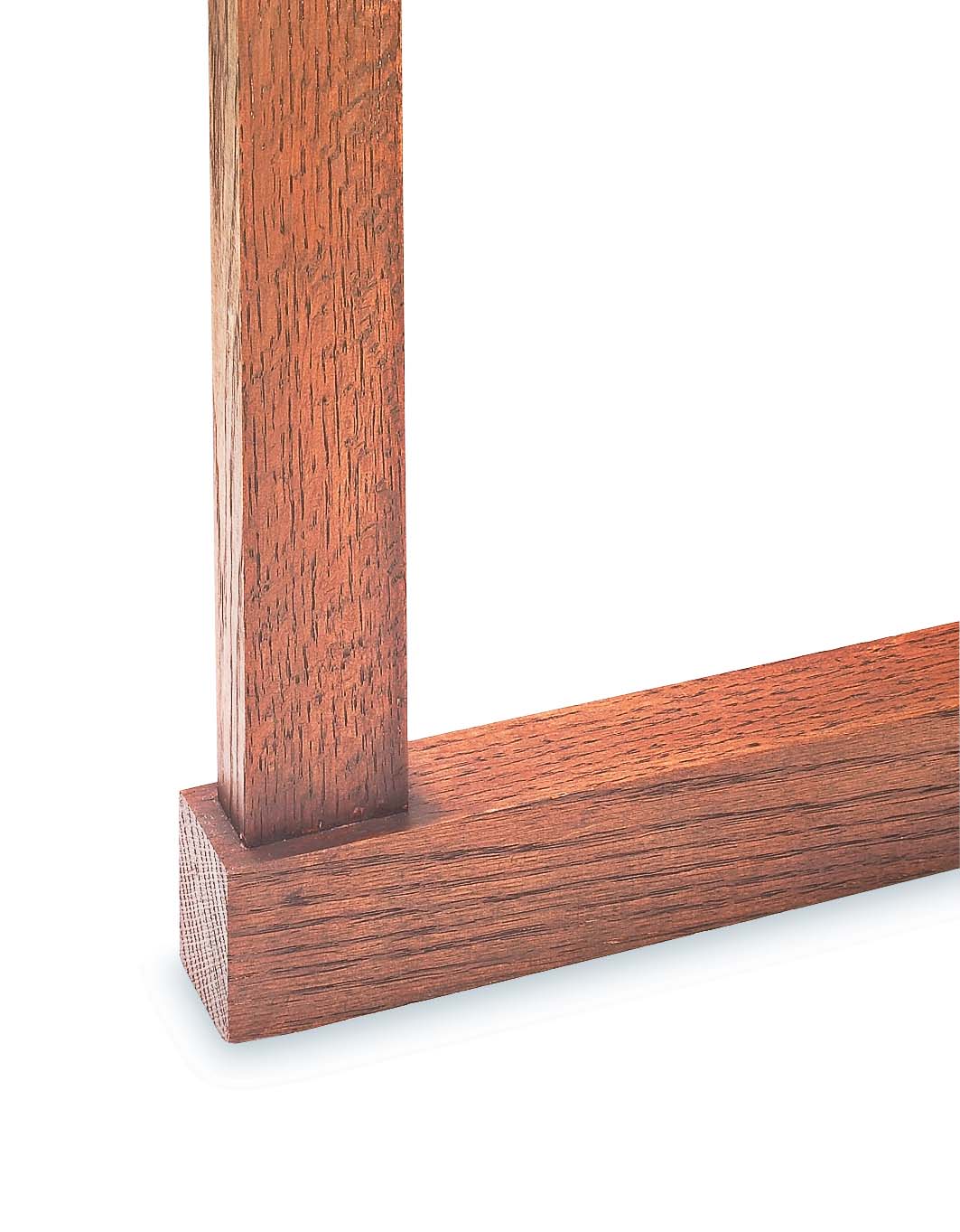 joint of wood frame with a dark buildup of finish