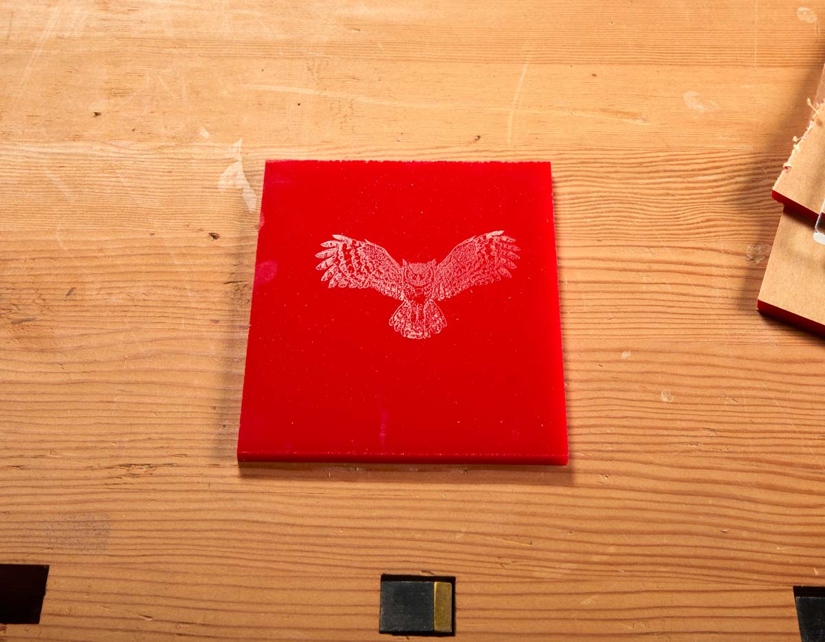 owl midflight engraved in red acrylic