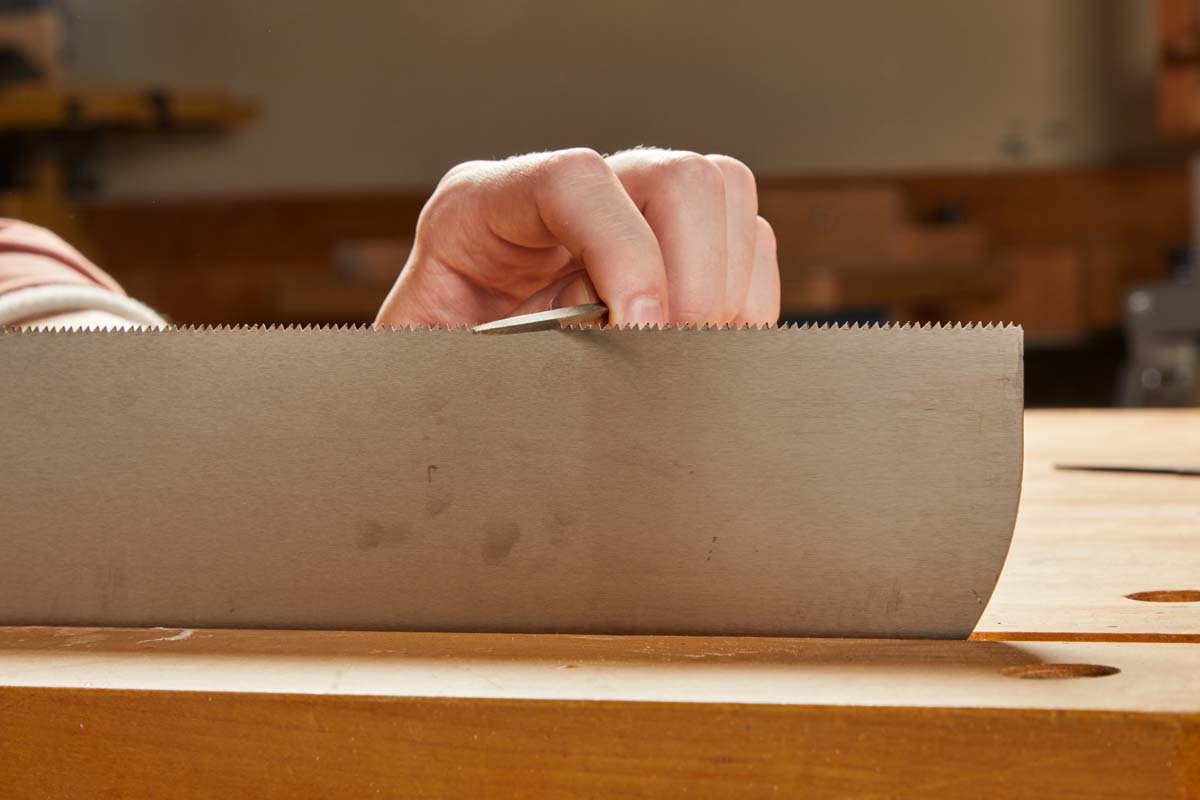 sharpening individual teeth of saw