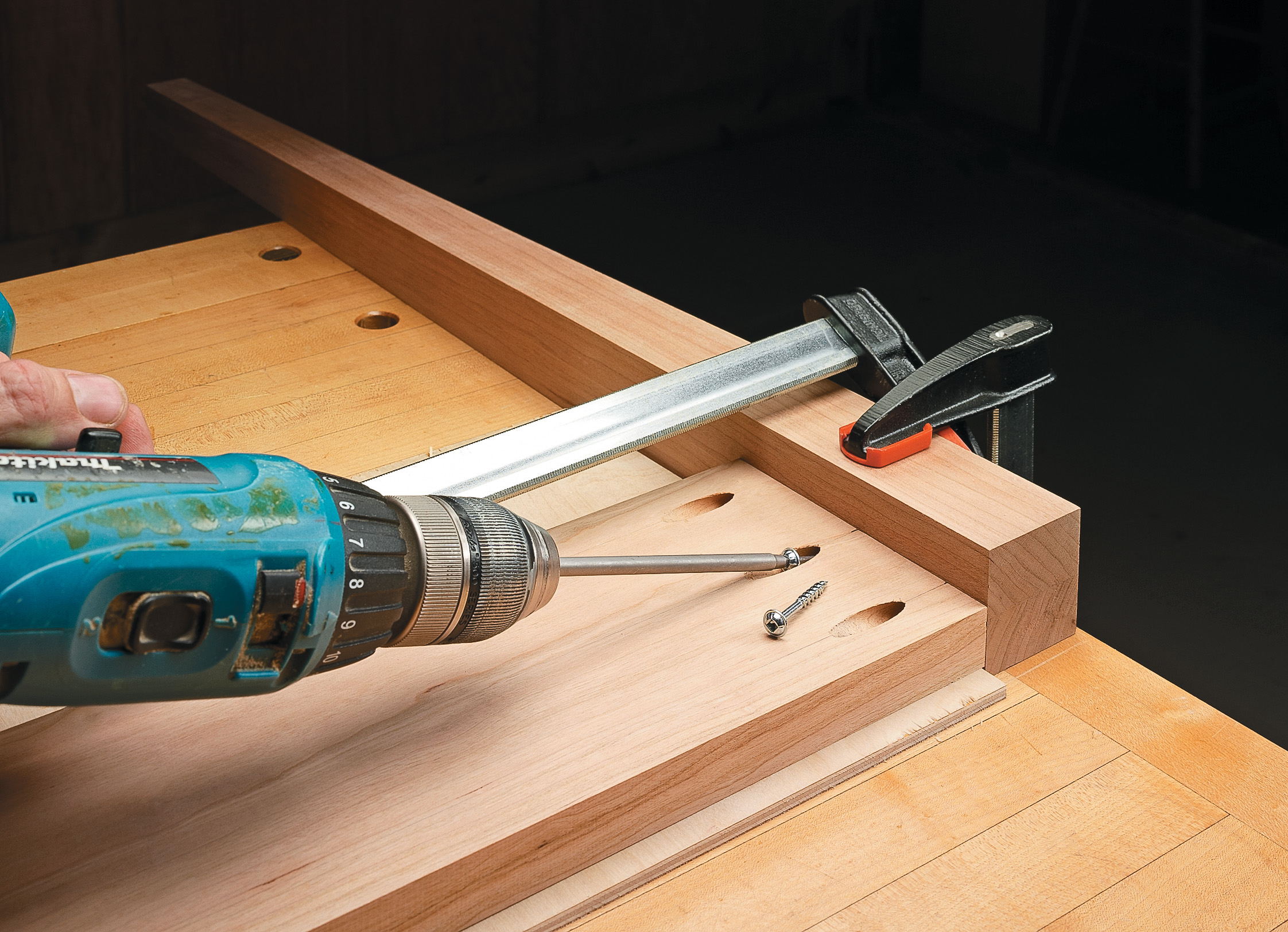 drilling pocket holes in clamped wood board