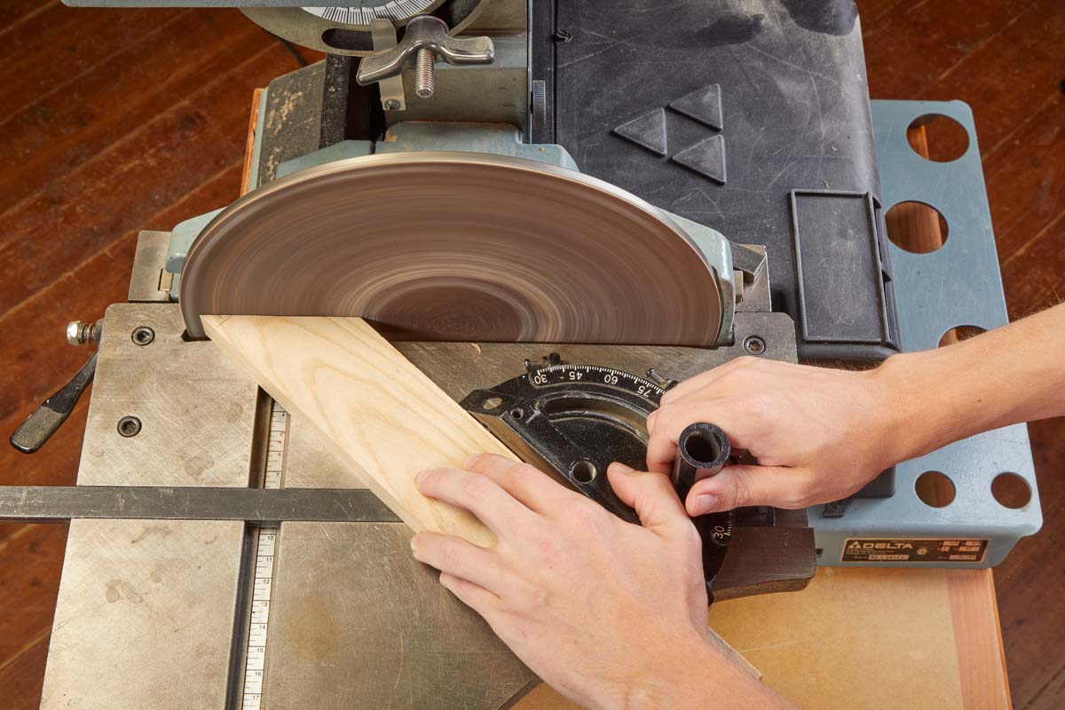 using miter gauge at the belt and disc sander to keep wood at an angle
