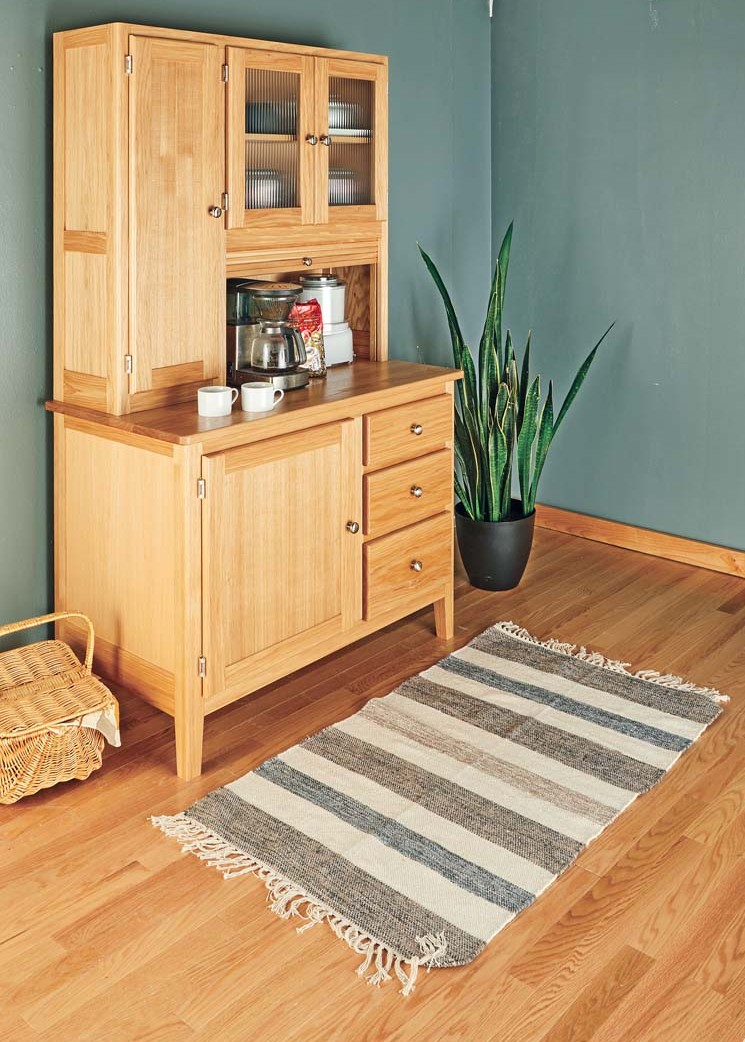 cabinet has easy to grab appliance cubby with pull down garage style door