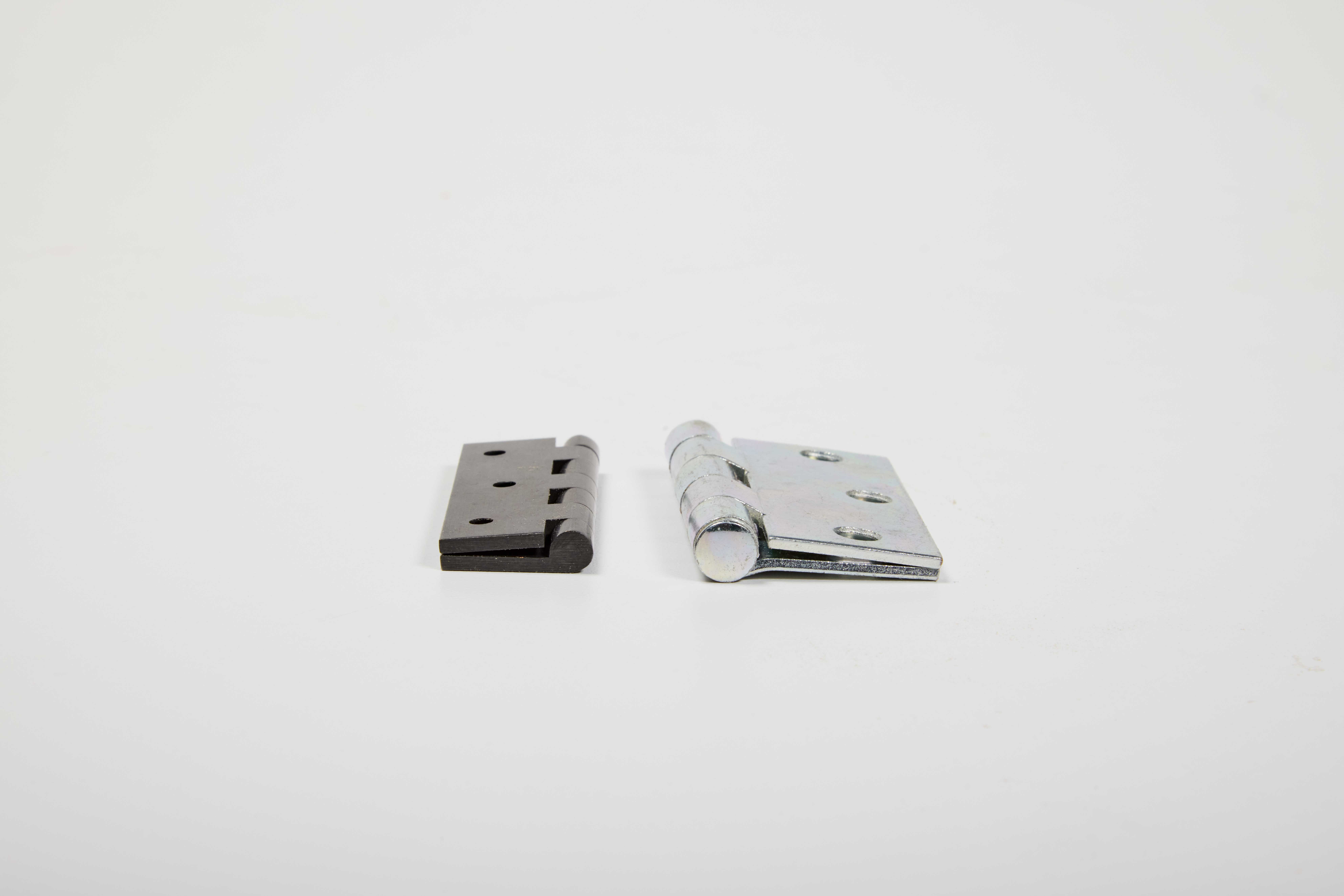 image shows two swaged hinges one iron black and one silver