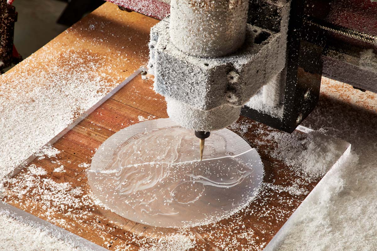 CNC cutting dog design in clear plastic