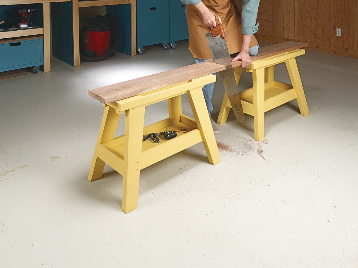 image of cutting wood on yellw saw bench 