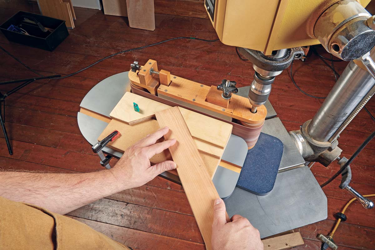 photo of diagram of chamfer sander jig being used with wood board