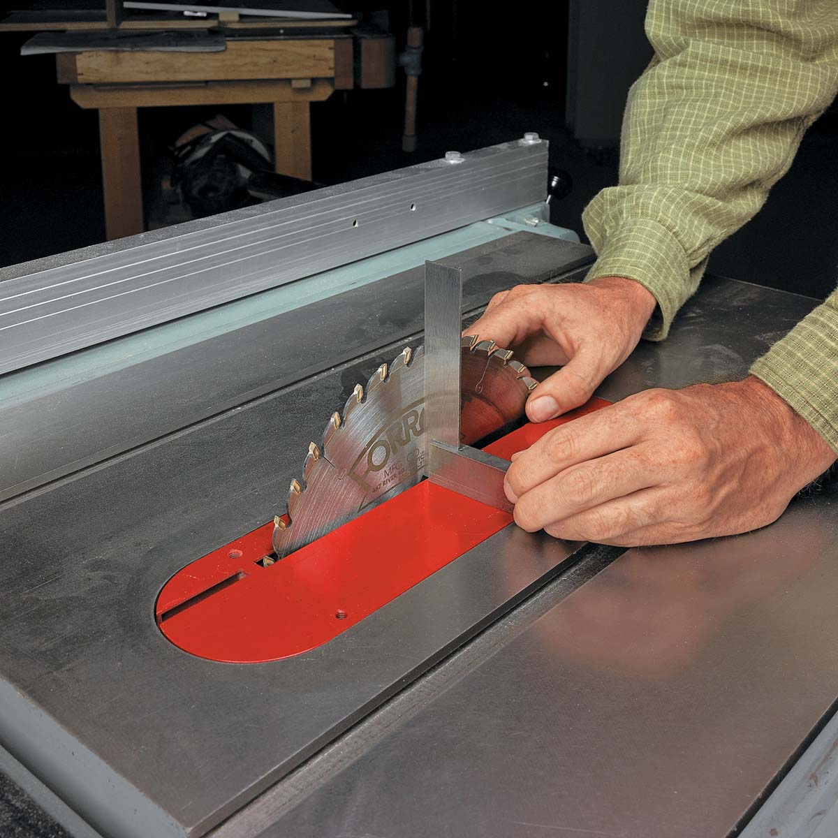 Using machinist square to measure saw blade and miter gauge