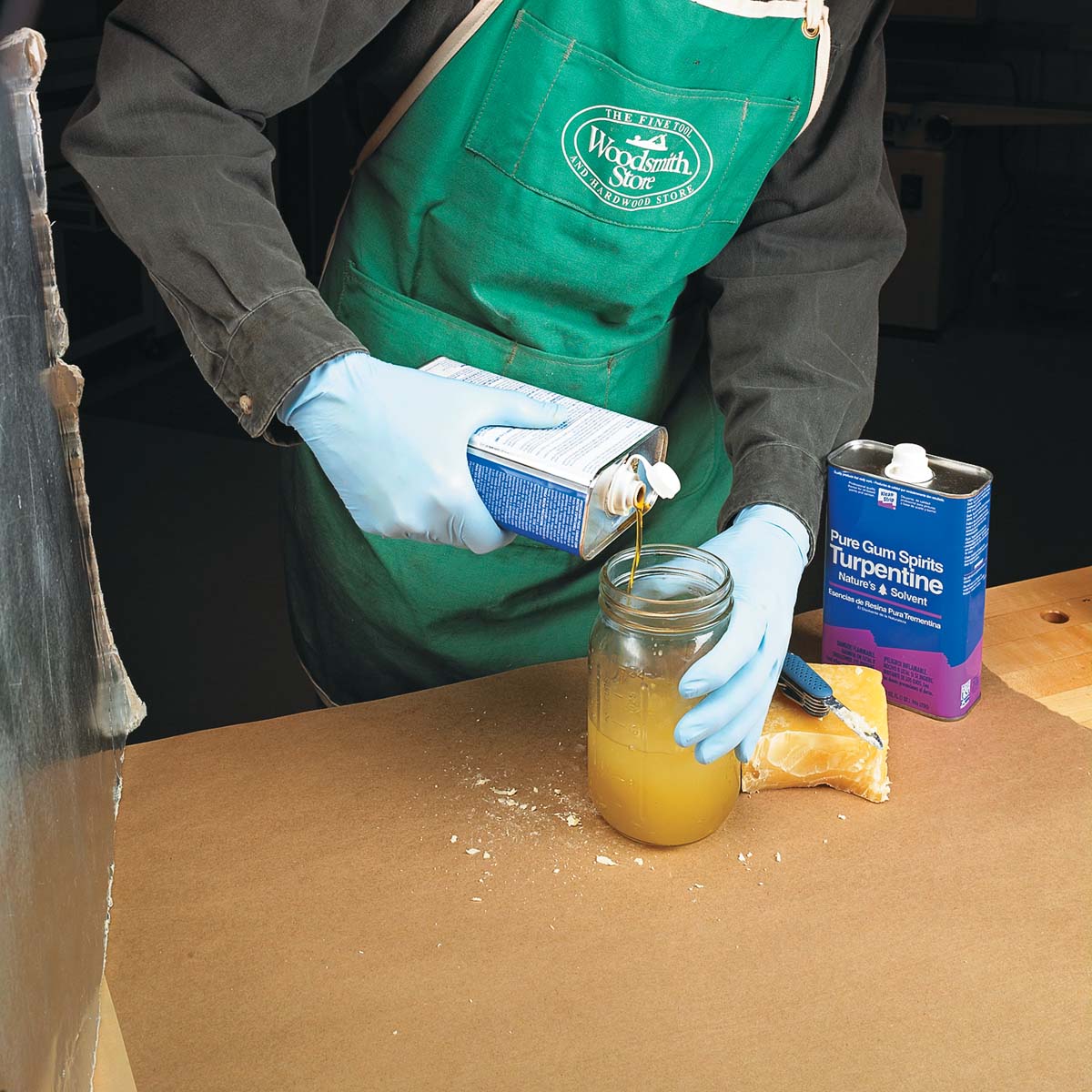 pouring linseed oil into mason jar