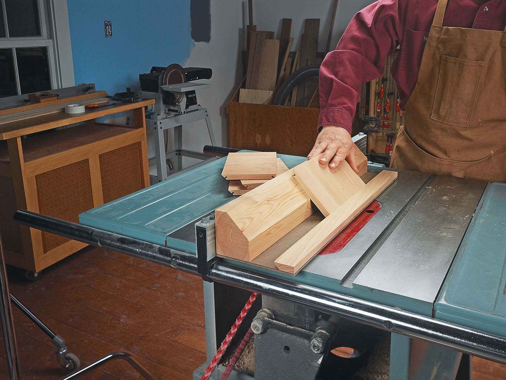 cutting mitered piece of wood on jig