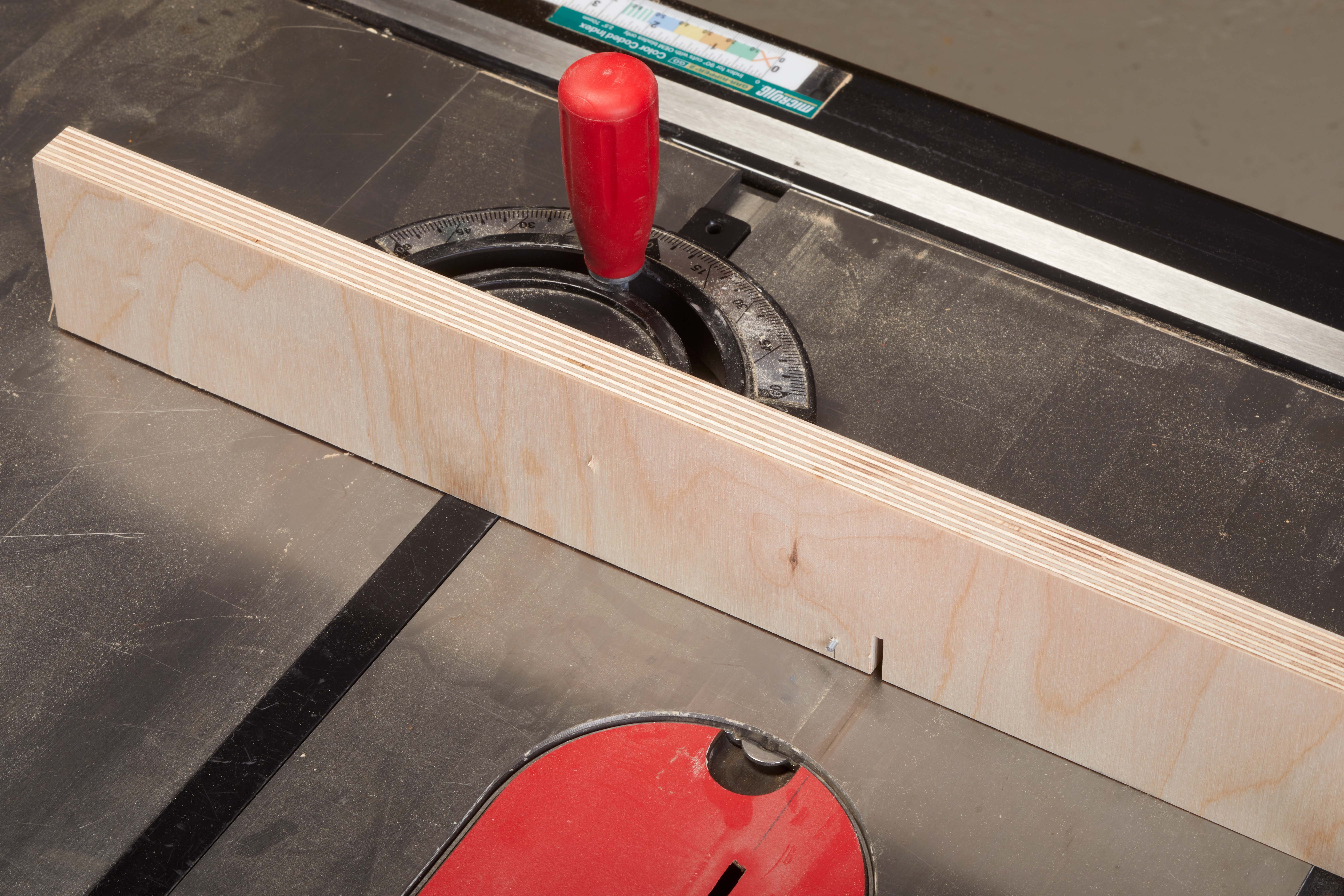 auxiliary fence with miter gauge and key to help make cut for kerf bending