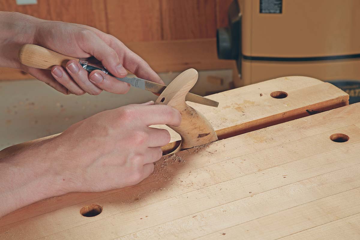 shaping down rest of wood patch with file