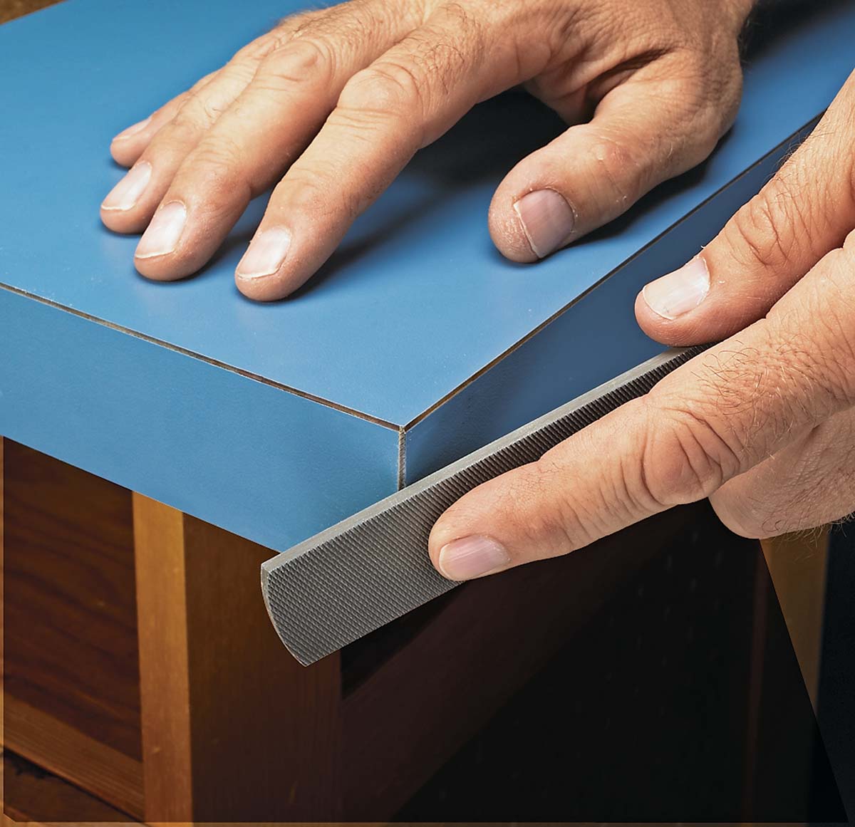 using flat file to smooth down laminate edges