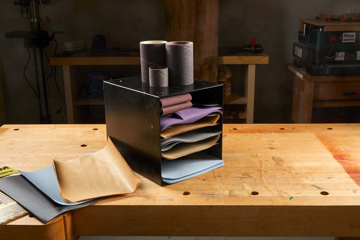 using thrifted paper organizer to hold sandpaper