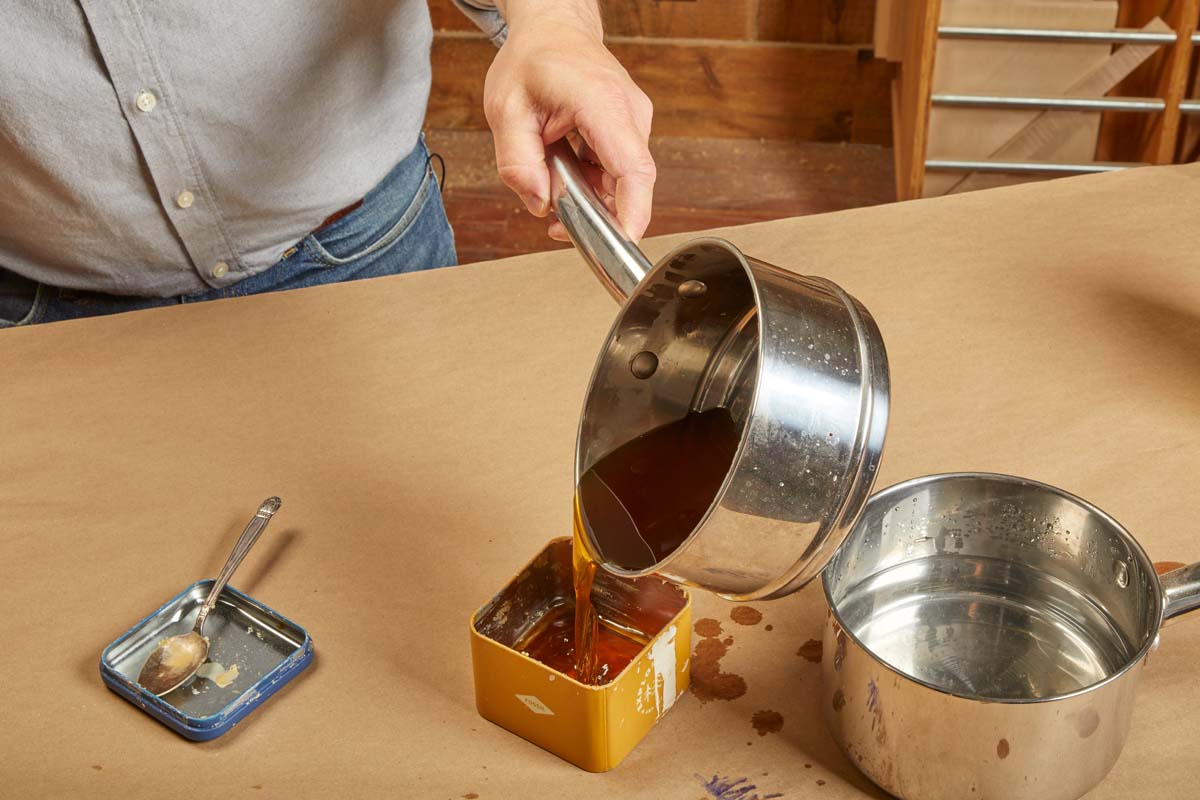 pouring mixture into metal tin to cool off