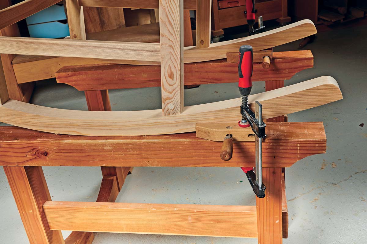 image showing rocking chari secured with woodscrew clamps, attached to sawhorses with F-clamps