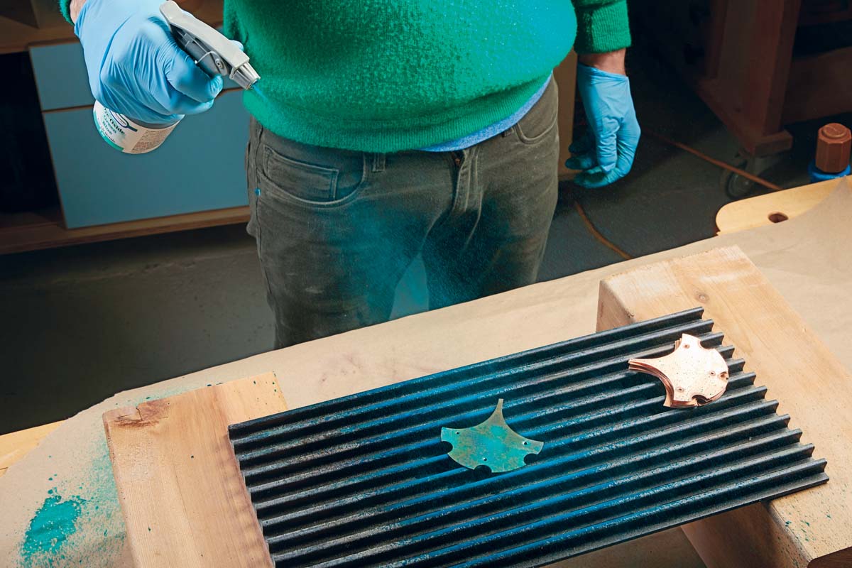 spraying dye-oxide tourquise on copper ginkgo leaf
