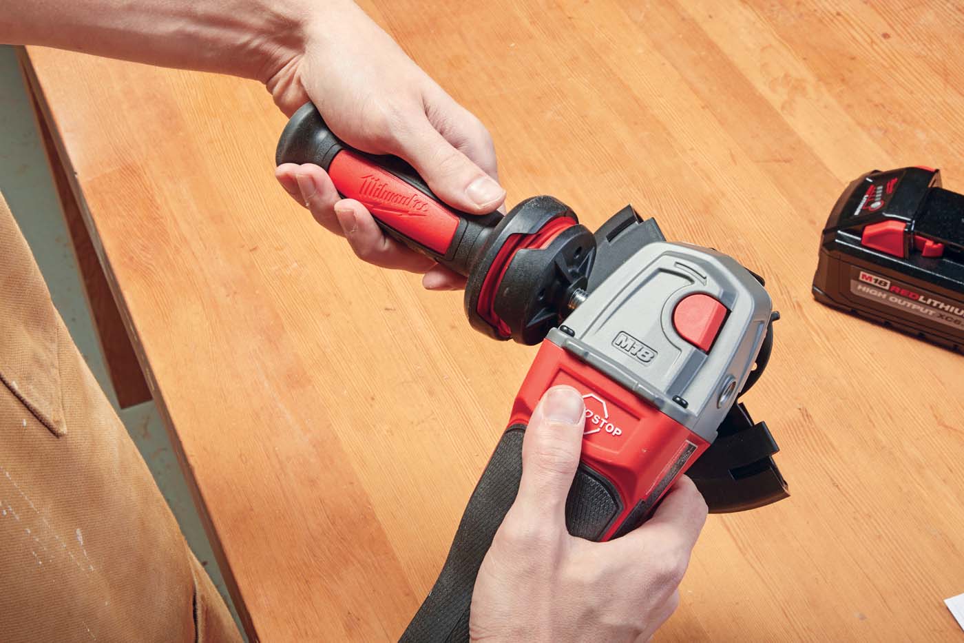 *Milwaukee’s* cordless grinder reversable handle for left and right