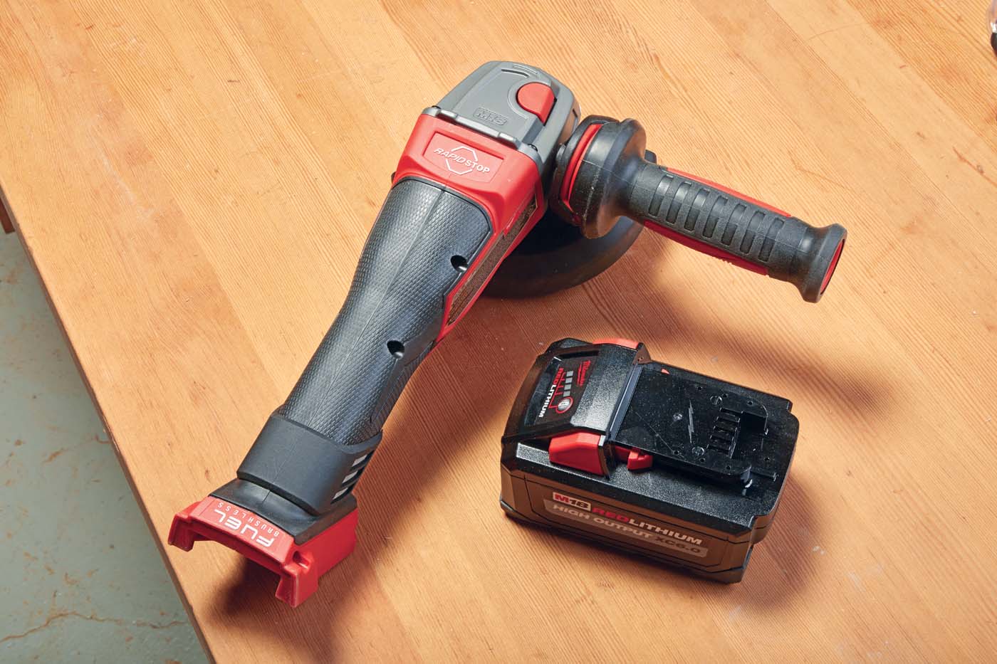 *Milwaukee’s* cordless grinder reversable handle for left and right