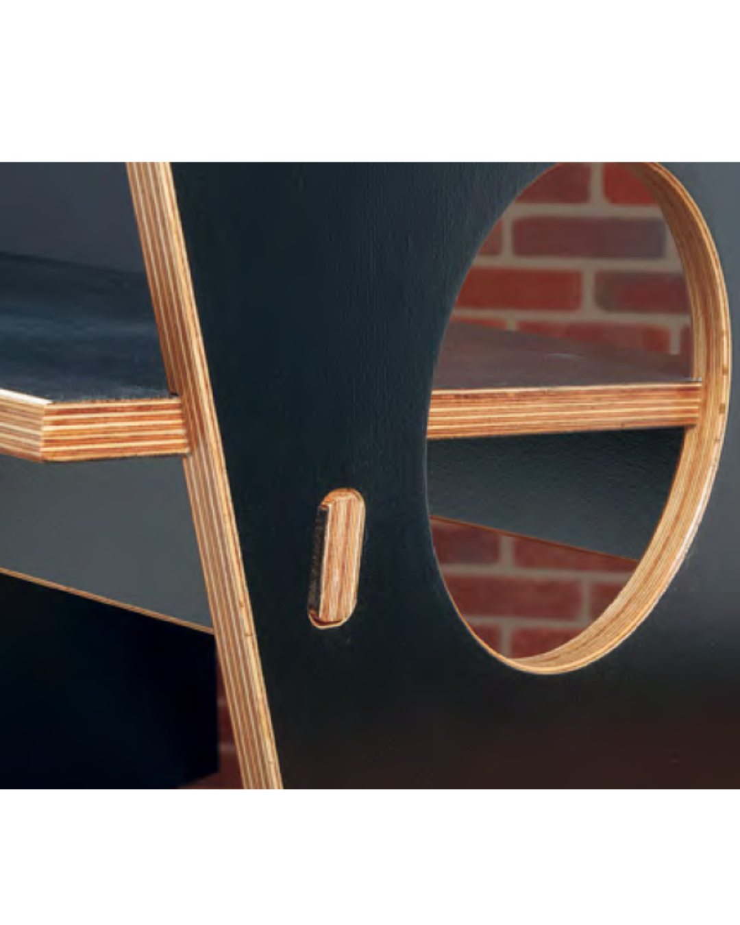 Image shows shelf painted black but with natural wood color edges