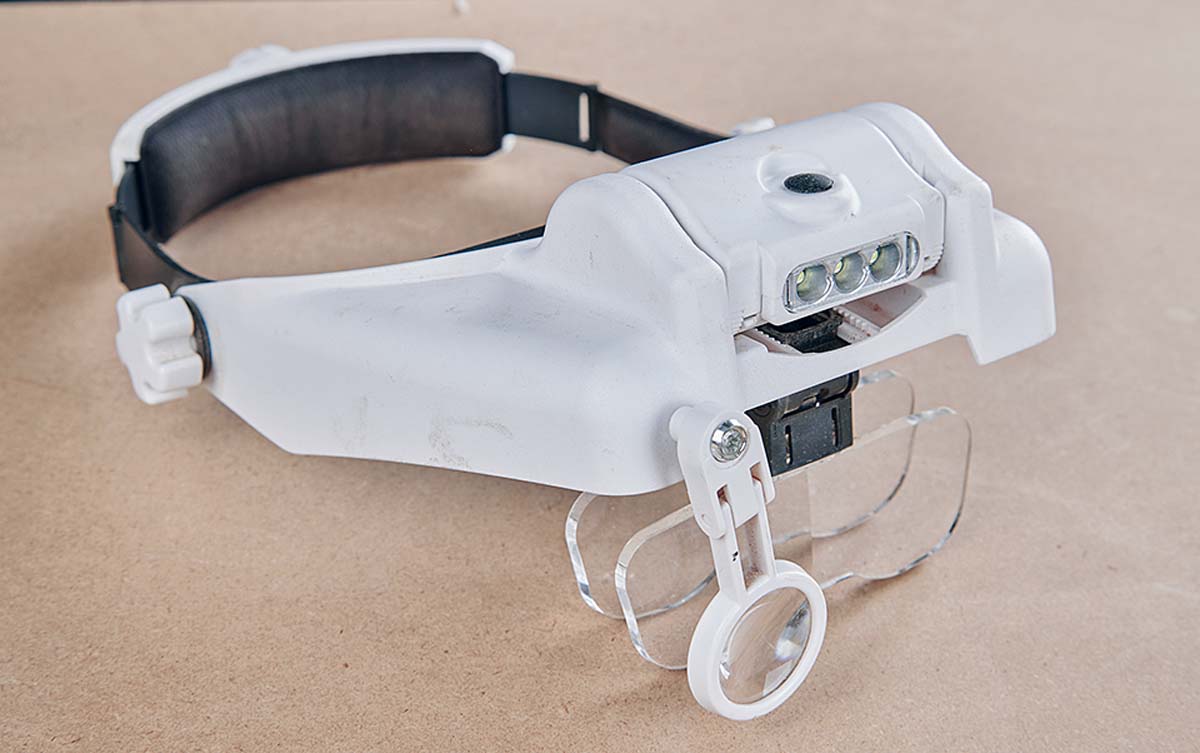 magnifying visor with headlight