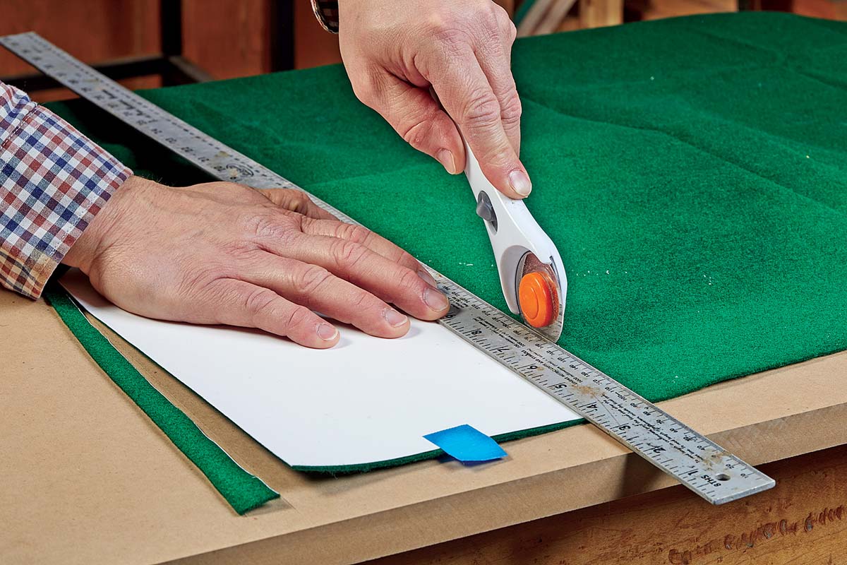 using wheel cutter to cut green felt