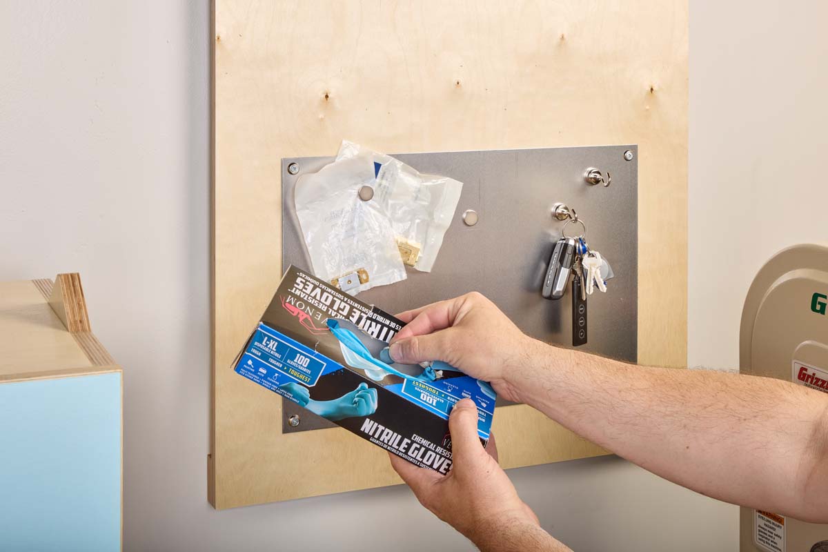 attaching nitrile glove box to magnet board