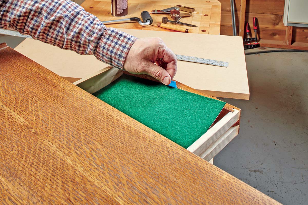 adding blue painter tape to felt drawer bottom as a pull tab
