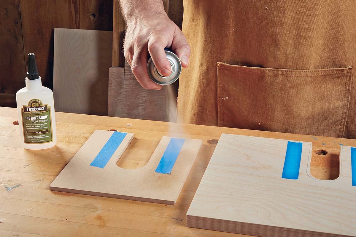 spraying instant glue accelerator on blue masking tape