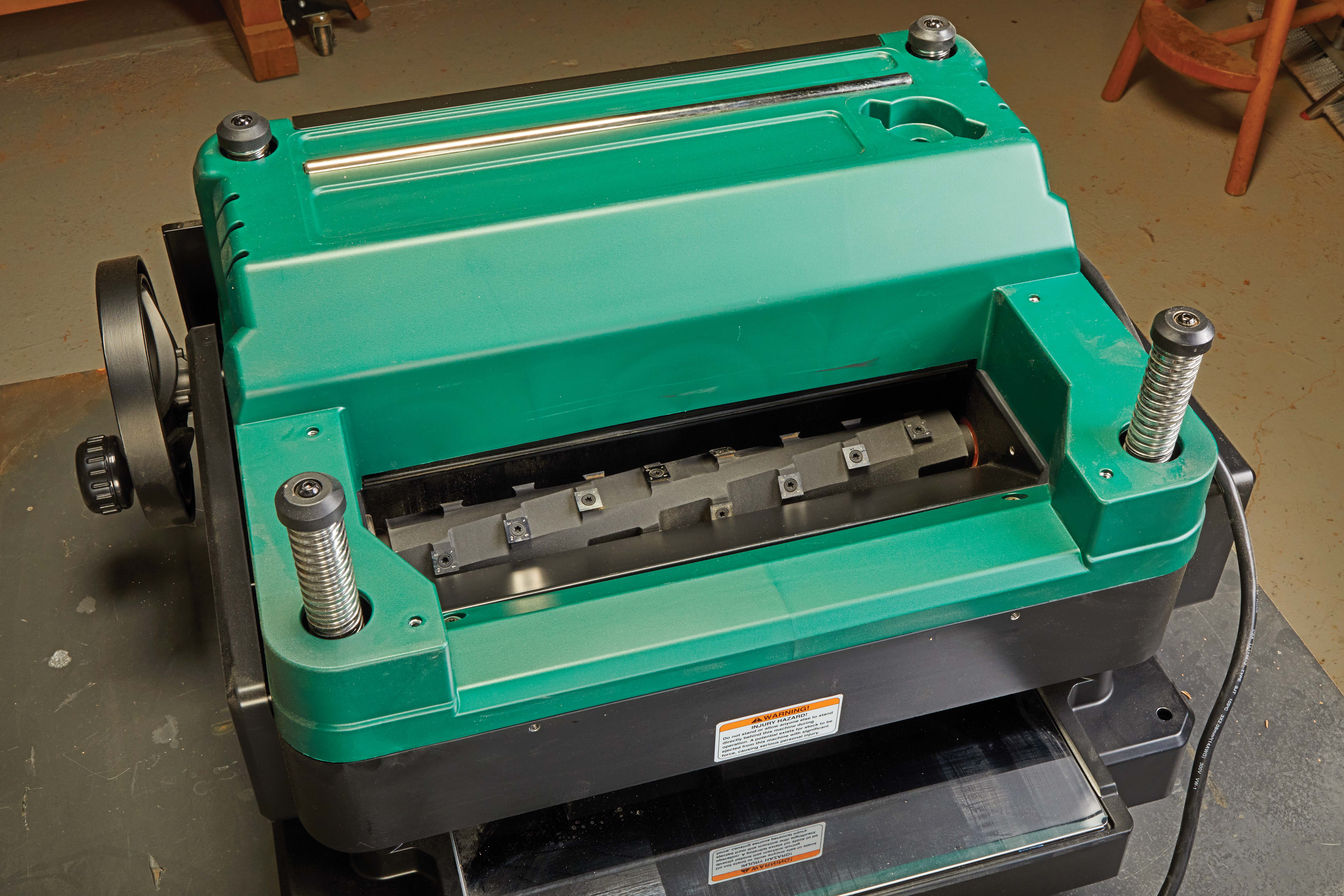 GRIZZLY BENCHTOP PLANER with a spiral cutterhead with carbide inserts