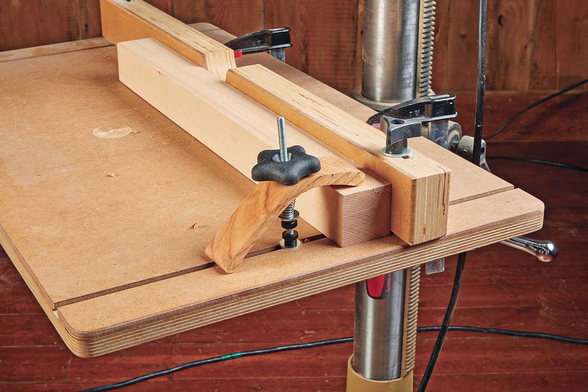 photo of spring handier hold down jig made of spring, washer, knurled nut, washer, threaded stem