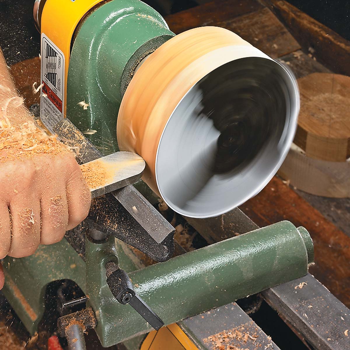 Smoothing edges of turned gift box on lathe with round-nose scrapper