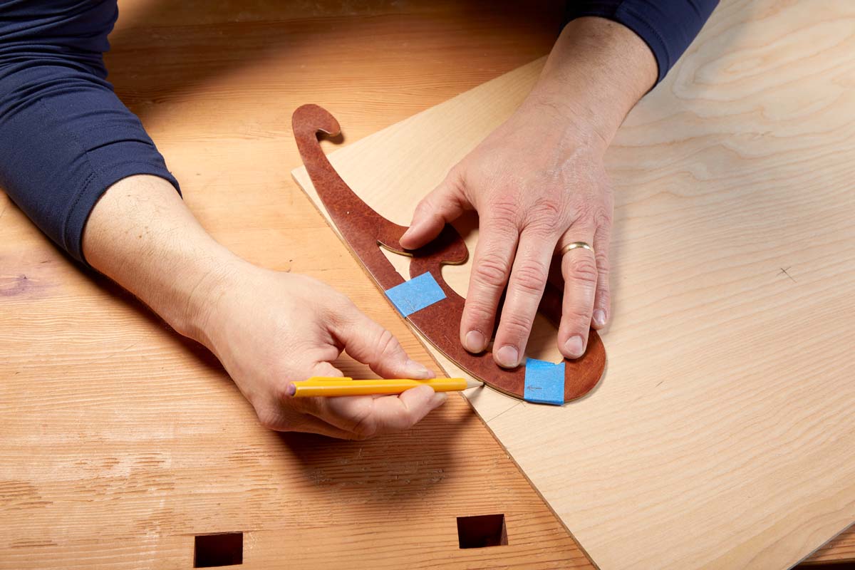 tracing French curves on plywood with template side