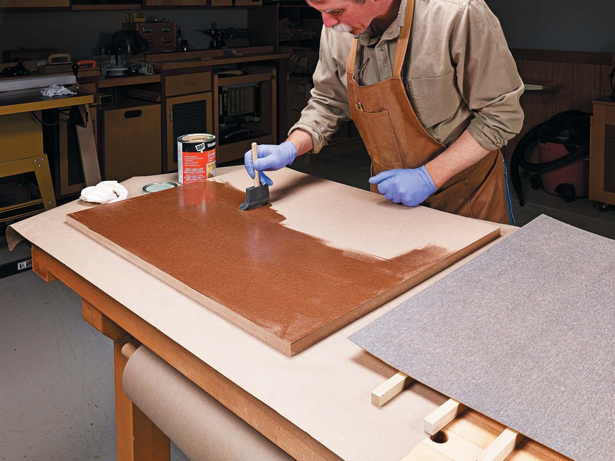 using foam brush to apply adhesive for plastic laminate on wood