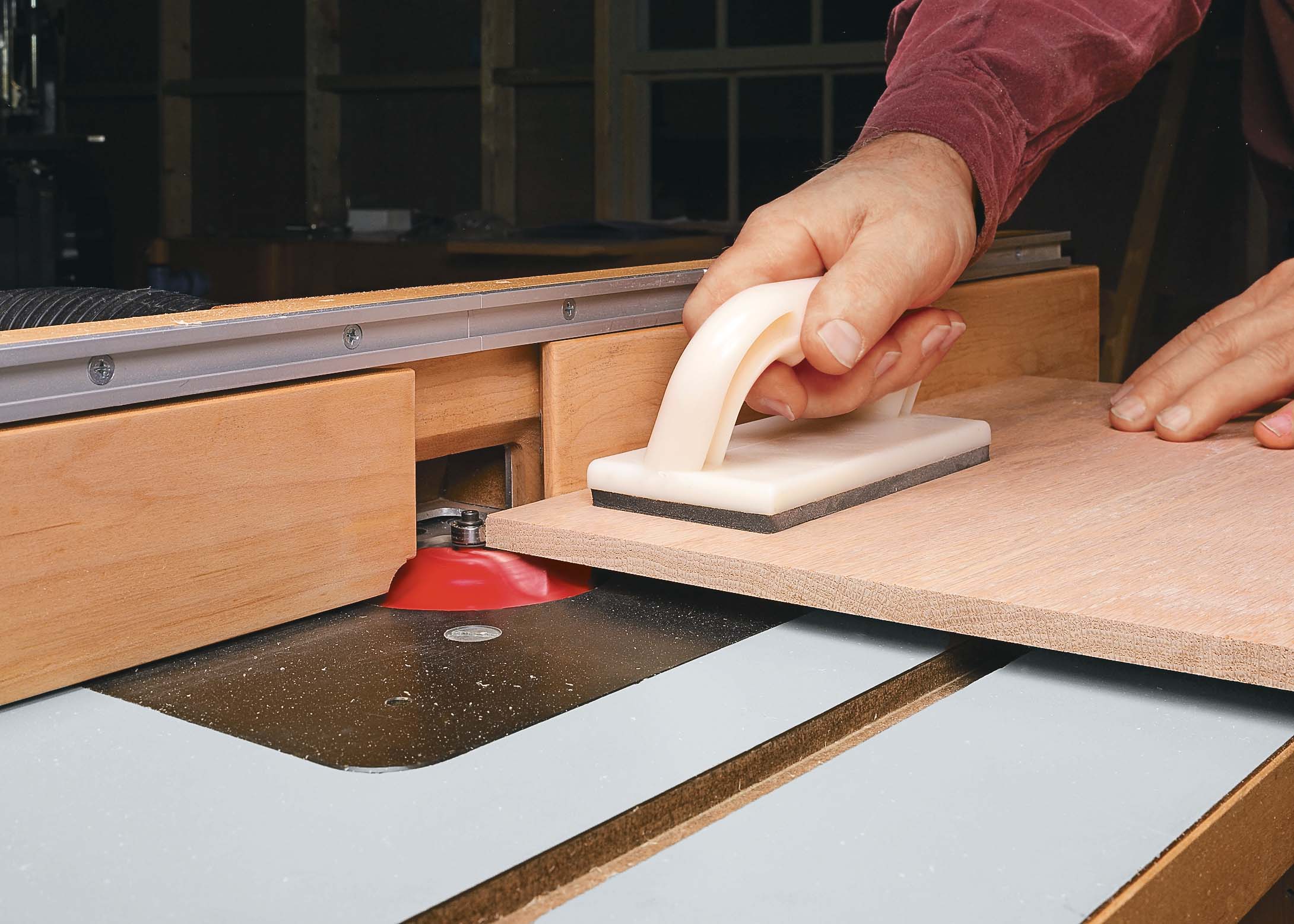 Using push pad to keep wood panle flat on table